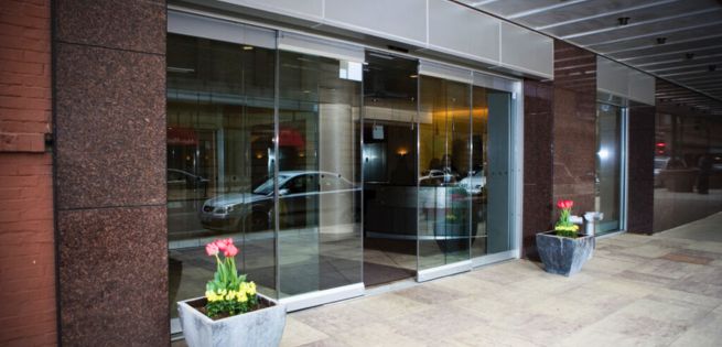 elegant glass sliding door at the front of a restaurant