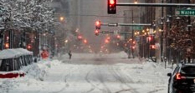 snowy commercial office buildings and street